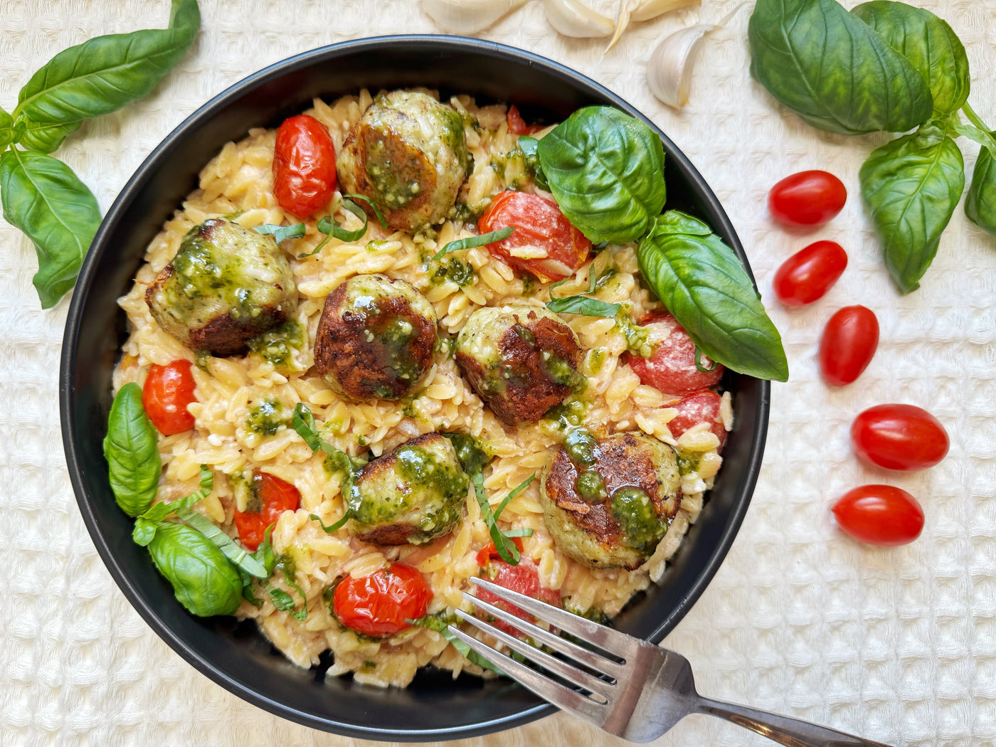 PESTO CHICKEN MEATBALLS WITH CREAMY BURST TOMATO ORZO
