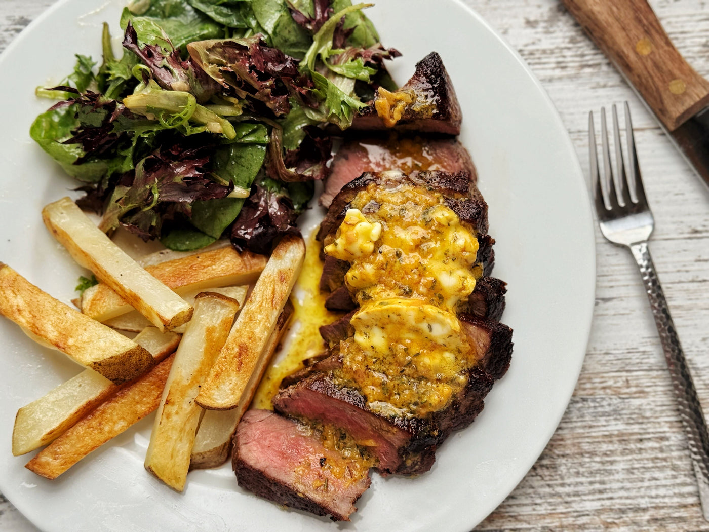 PAN-SEARED NY STEAK WITH CAFE DE PARIS BUTTER