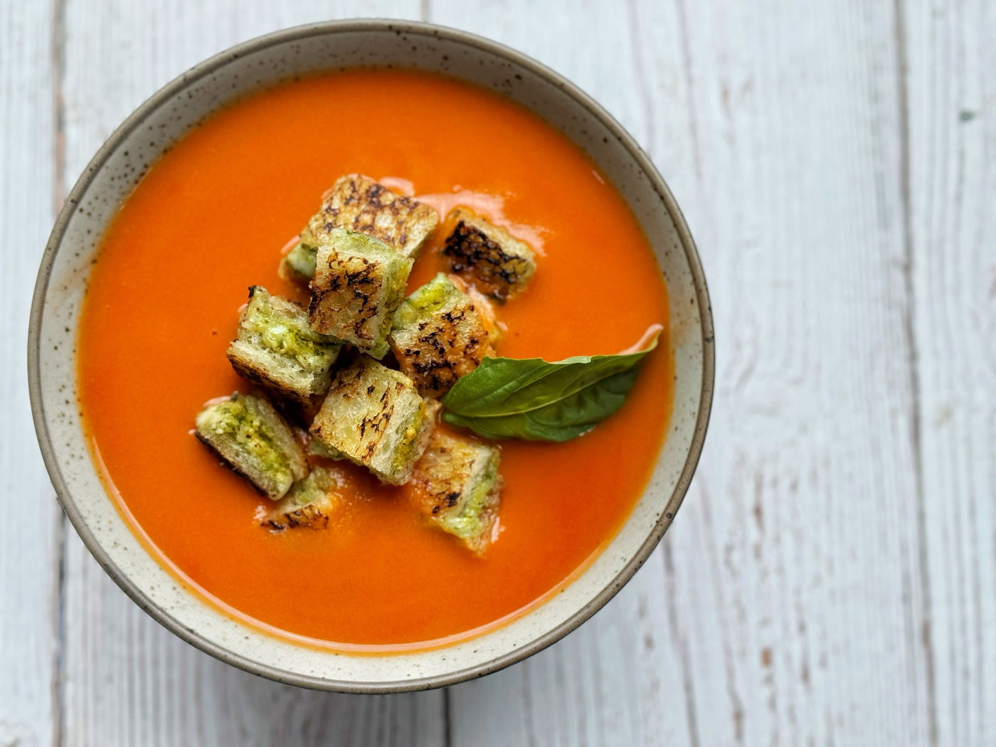 TOMATO SOUP WITH PESTO GRILLED CHEESE CROUTONS