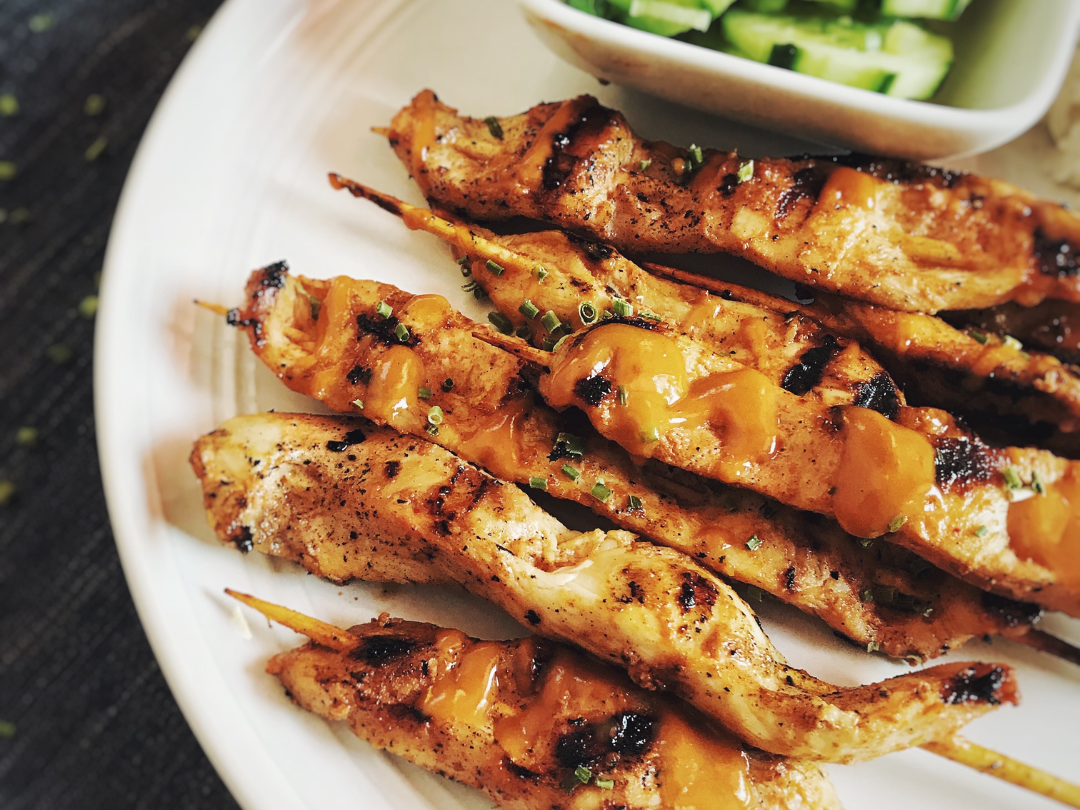GRILLED CHICKEN SATAY WITH CURRIED PEANUT SAUCE & CUCUMBER SALAD