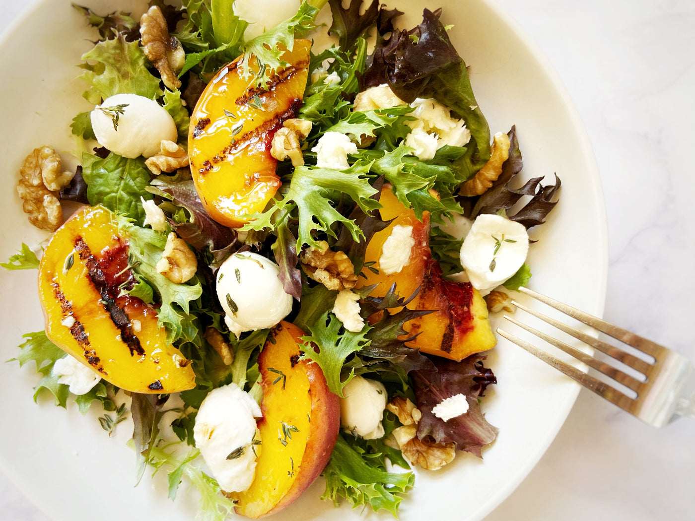 GRILLED PEACH SALAD WITH MOZZARELLA & HONEY VINAIGRETTE