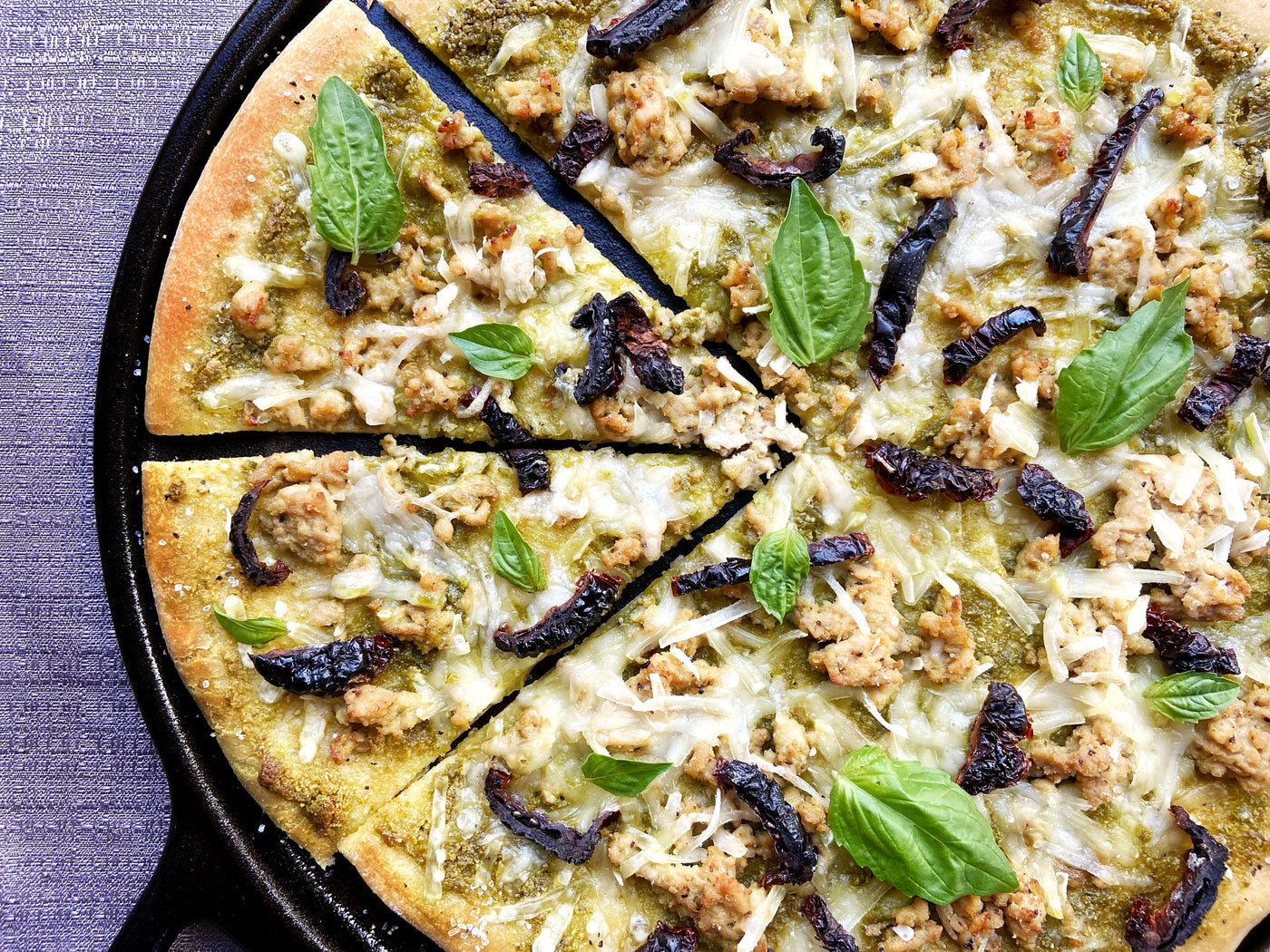PESTO PIZZA WITH ITALIAN SAUSAGE & SUN-DRIED TOMATOES